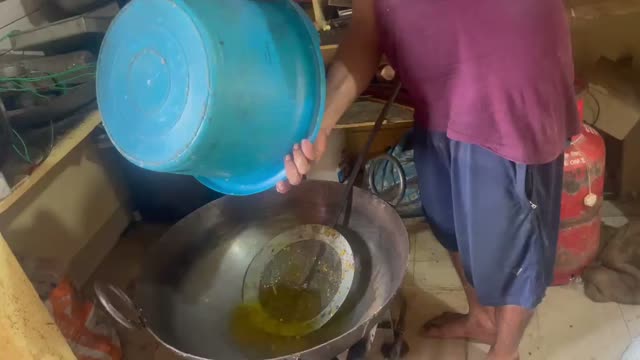 Filling Frying Pan with Oil